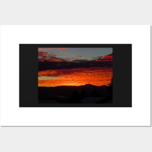 Burnt orange sunset reflecting off the clouds Posters and Art